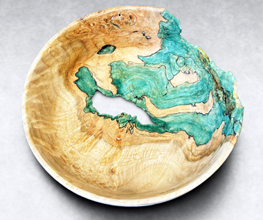 Bottomless Bowl – Oregon maple burl spalted with elf’s cup (Chlorociboria spp.) fungus. By Seri Robinson.