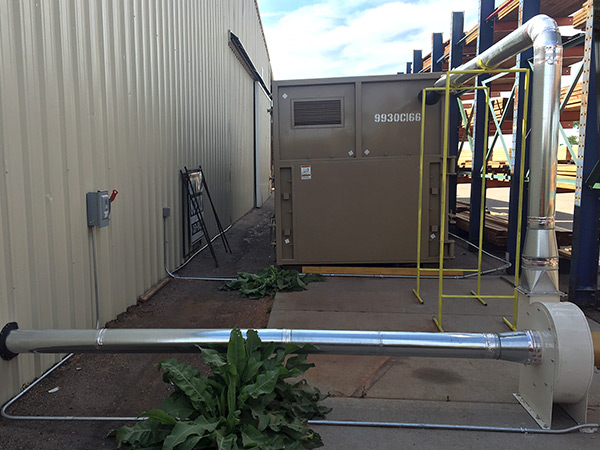 The transfer blower installed outside conveys the air from the dust collector to the remote container.
